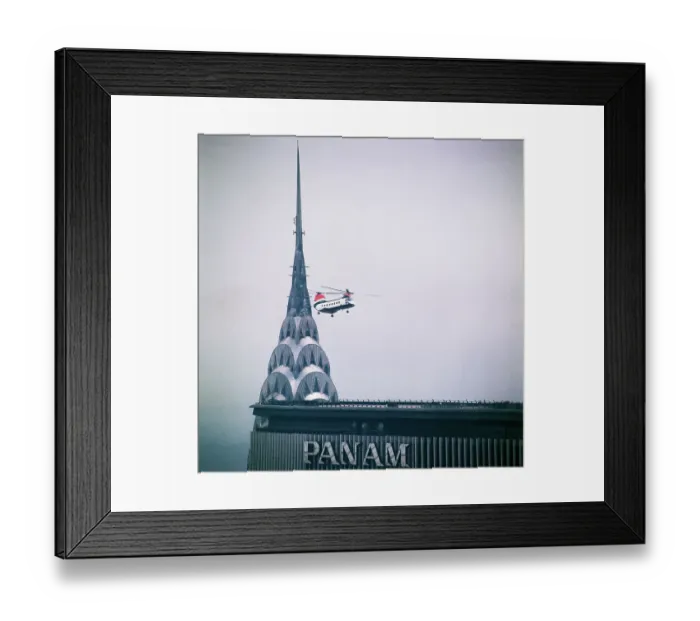 Framed Print : Helicopter Hovering Above Building Framed Print : Helicopter Hovering Above Building