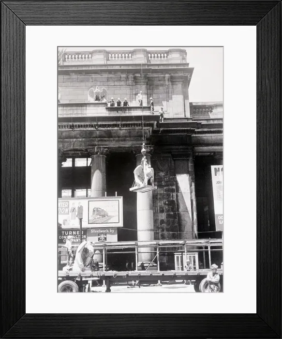 Framed Print : Men Lowering Statue from Building