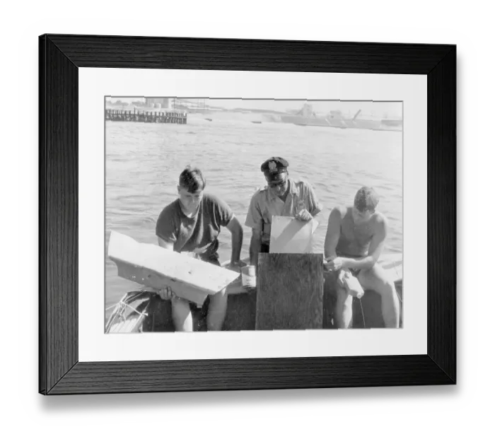 Framed Print : Men Examining Debris on Boat Framed Print : Men Examining Debris on Boat
