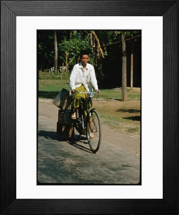 Framed Print : View of a Local Indonesian Inhabitant Riding Bicycle Framed Print : View of a Local Indonesian Inhabitant Riding Bicycle