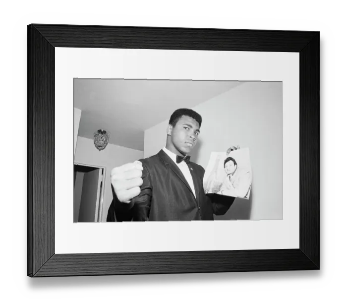 Framed Print : Muhammad Ali with Picture of Opponent Framed Print : Muhammad Ali with Picture of Opponent