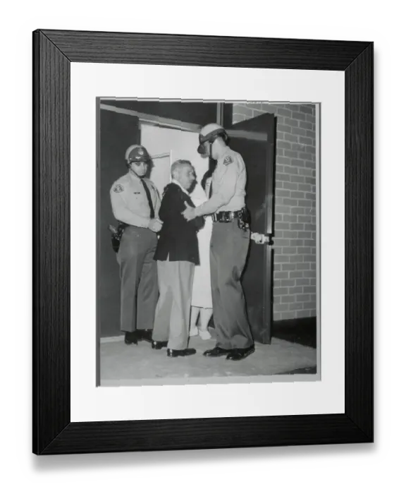 Framed Print : Mike Romanoff Being Escorted by Police Framed Print : Mike Romanoff Being Escorted by Police