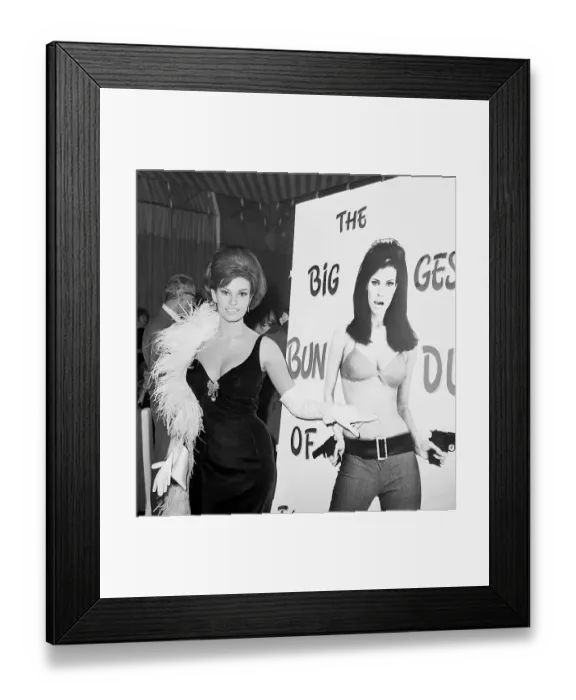 Framed Print : Raquel Welch Standing By a Poster of Herself Framed Print : Raquel Welch Standing By a Poster of Herself
