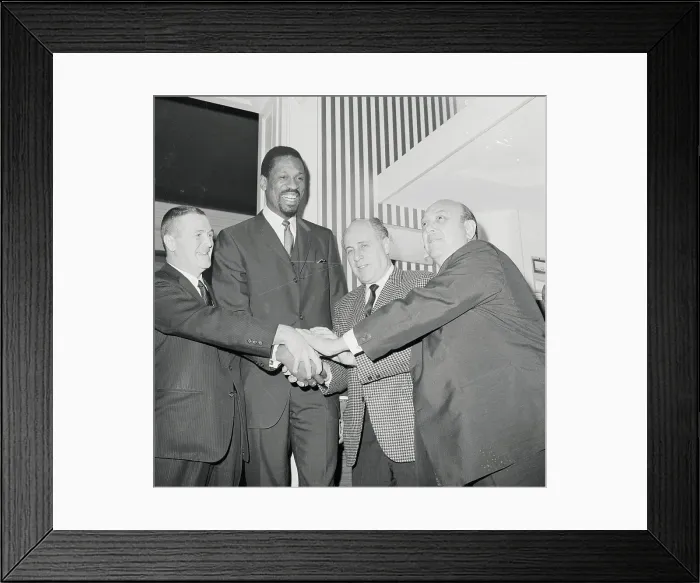 Framed Print : Bill Russell Joining Hands with Officials Framed Print : Bill Russell Joining Hands with Officials