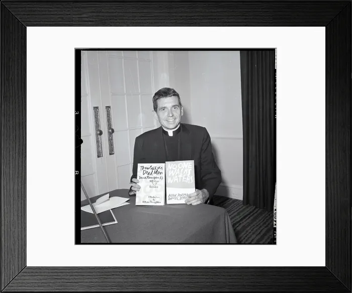 Framed Print : Jesuit Daniel Berrigan Holding Books Framed Print : Jesuit Daniel Berrigan Holding Books