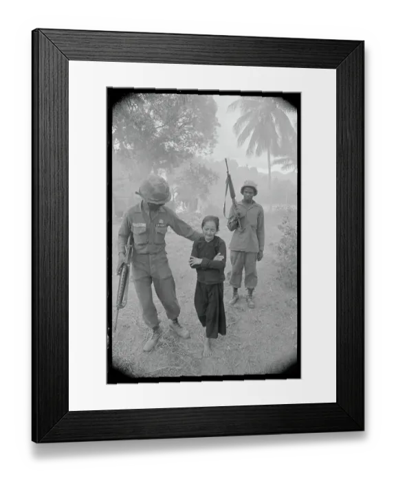 Framed Print : Soldier Escorting a Vietnamese Woman Framed Print : Soldier Escorting a Vietnamese Woman