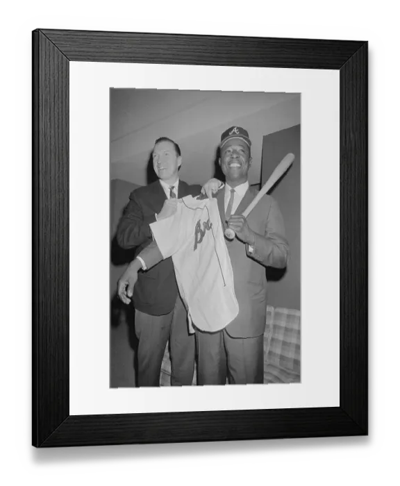Framed Print : Hank Aaron Being Assisted with Uniform Shirt and Baseball Bat Framed Print : Hank Aaron Being Assisted with Uniform Shirt and Baseball Bat