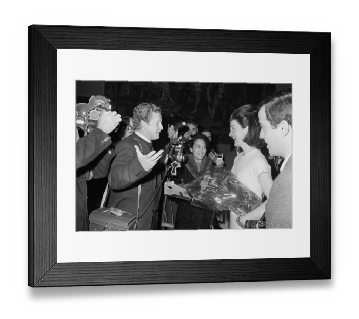 Framed Print : Mrs. Kennedy with Photographers Holding Carnations Framed Print : Mrs. Kennedy with Photographers Holding Carnations