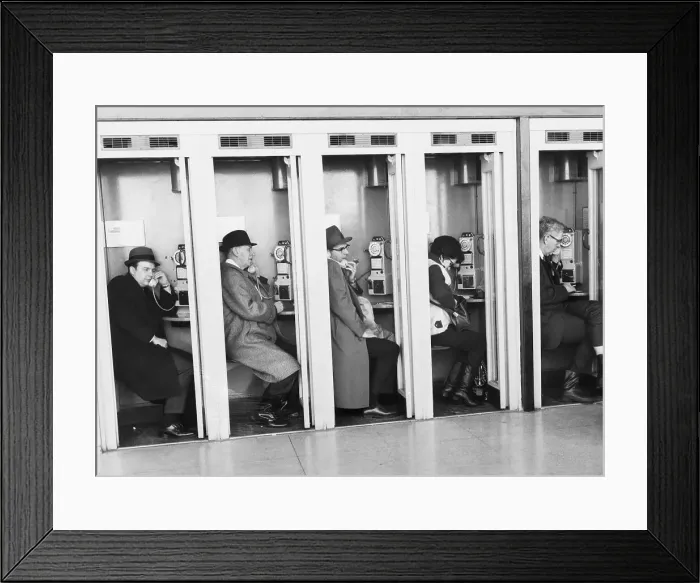 Framed Print : People at Airport In Pay Phone Booths Framed Print : People at Airport In Pay Phone Booths