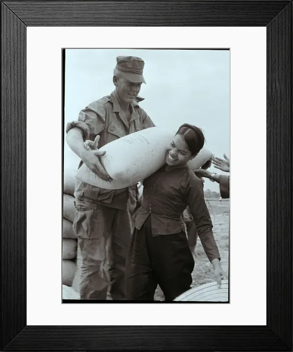 Framed Print : Vietnamese Woman Helps US Marine Framed Print : Vietnamese Woman Helps US Marine