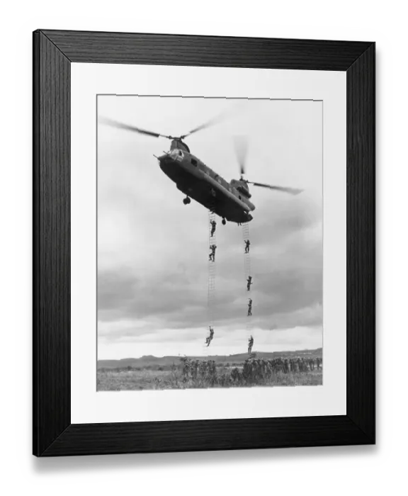 Framed Print : Helicopter With Men Climbing Down Ladder