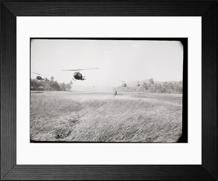 Framed Print : Helicopter Hovering over Soldier in Rice Field Framed Print : Helicopter Hovering over Soldier in Rice Field
