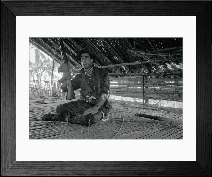 Framed Print : Sean Flynn Sitting with Rifle Framed Print : Sean Flynn Sitting with Rifle