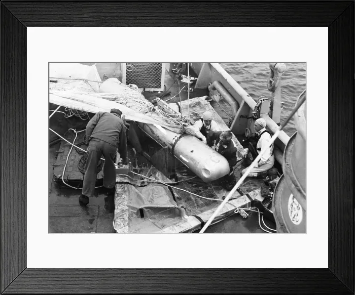 Framed Print : Crewmen Tie Down Bomb Recovered From Sea Framed Print : Crewmen Tie Down Bomb Recovered From Sea