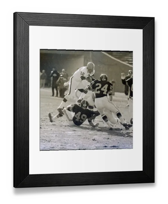 Framed Print : Jimmy Brown Stepping Over Bob Sherman