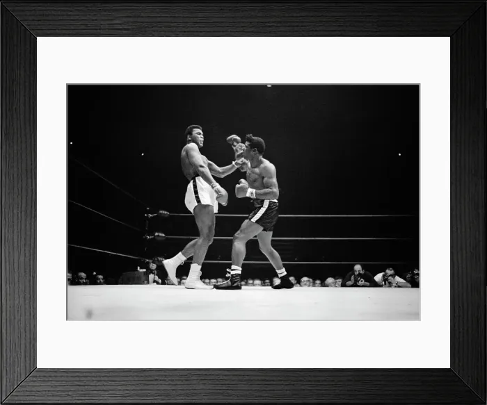 Framed Print : Cassius Clay Brushing Off Punches