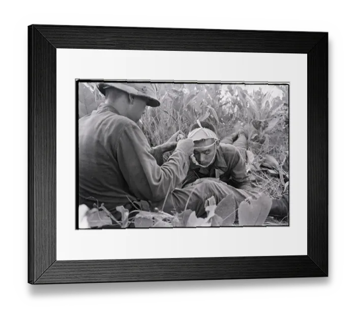 Framed Print : Soldier Helps Another Soldier with Bandage Framed Print : Soldier Helps Another Soldier with Bandage