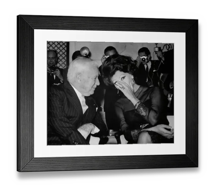 Framed Print : Sophia Loren Whispering to Charlie Chaplin Framed Print : Sophia Loren Whispering to Charlie Chaplin