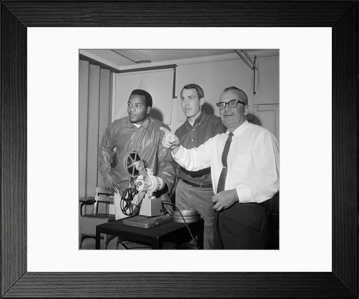 Framed Print : Jim Brown Looking at Video with Others Framed Print : Jim Brown Looking at Video with Others