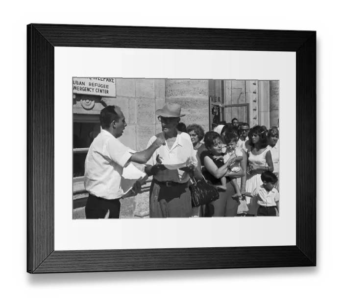Framed Print : Refugees Looking over Forms Framed Print : Refugees Looking over Forms