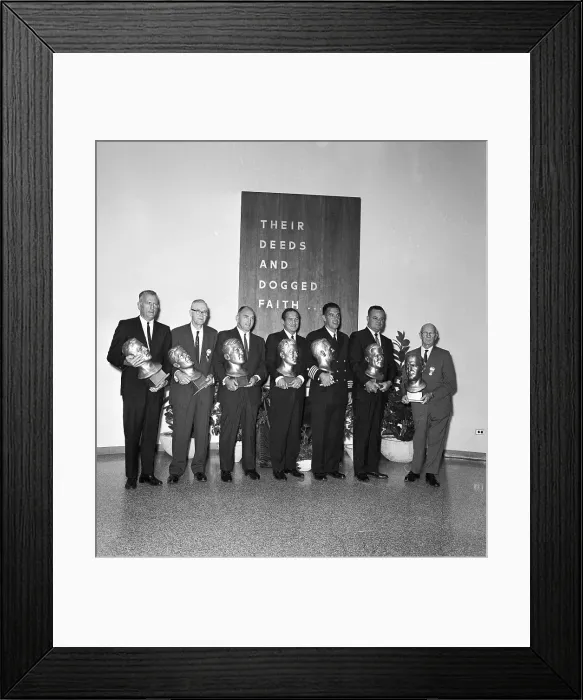 Framed Print : Football Players Holding Busts of Themselves Framed Print : Football Players Holding Busts of Themselves