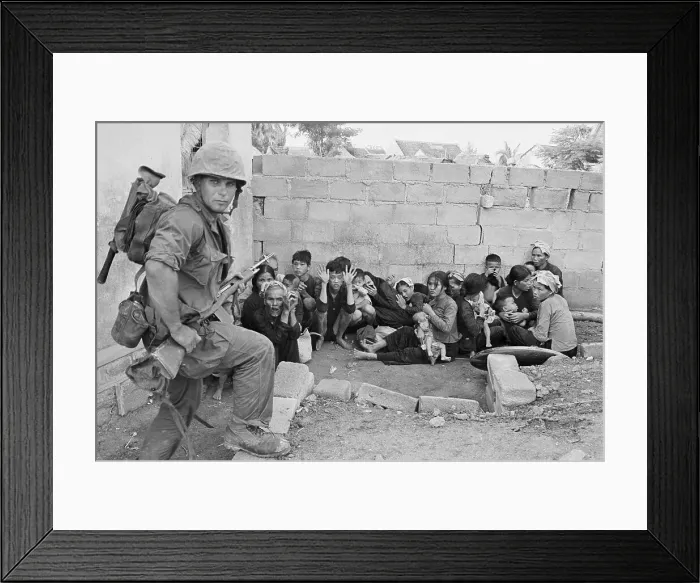 Framed Print : Soldier Guarding Civilians Framed Print : Soldier Guarding Civilians