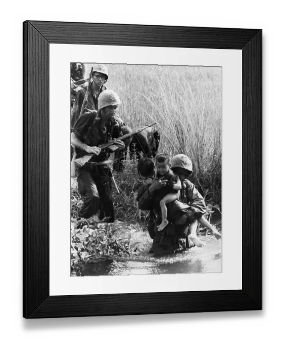 Framed Print : Us Marines Carry Crying Babies Framed Print : Us Marines Carry Crying Babies