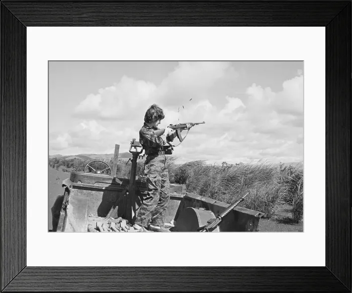 Framed Print : Reporter Firing M-16 Rifle During Vietnam War Framed Print : Reporter Firing M-16 Rifle During Vietnam War