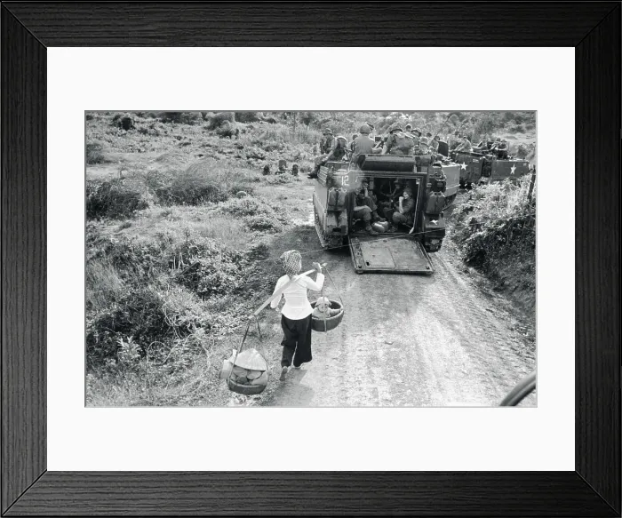 Framed Print : Vietnamese Woman Passing by Soldiers Framed Print : Vietnamese Woman Passing by Soldiers