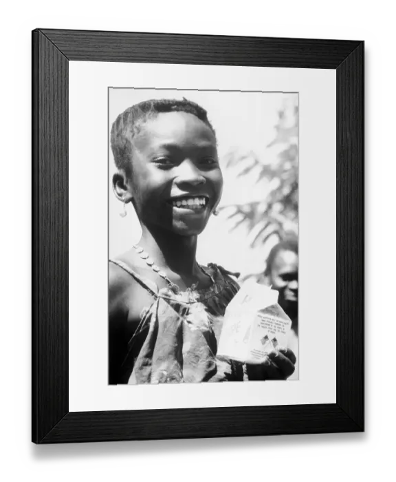 Framed Print : Young Guinea Child Holding Milk