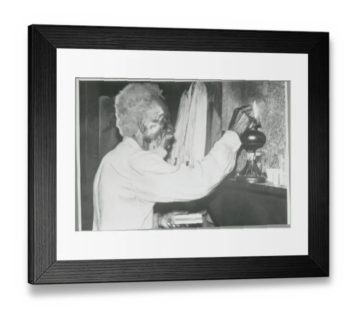 Framed Print : Old Man Lighting Oil Lamp Framed Print : Old Man Lighting Oil Lamp