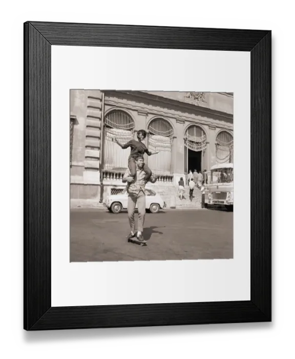 Framed Print : Man with Lady on Shoulders Riding Skateboard Framed Print : Man with Lady on Shoulders Riding Skateboard