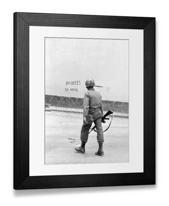 Framed Print : Soldier Walks Past Graffiti Framed Print : Soldier Walks Past Graffiti