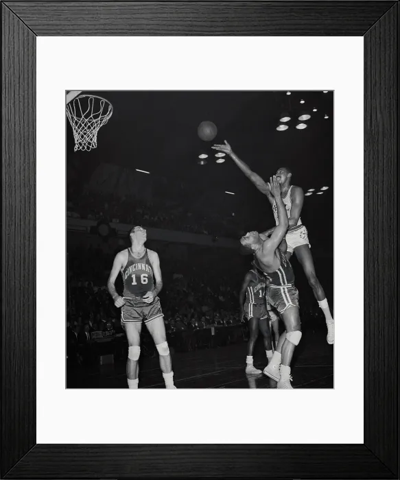 Framed Print : Wilt Chamberlain Jumping over Wayne Embry Framed Print : Wilt Chamberlain Jumping over Wayne Embry