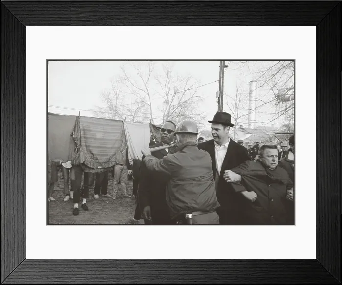 Framed Print : Policeman Using Club To Restrain Man Framed Print : Policeman Using Club To Restrain Man