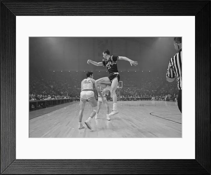 Framed Print : Bill Bradley Making Pass Under Legs of Jim Benedict Framed Print : Bill Bradley Making Pass Under Legs of Jim Benedict