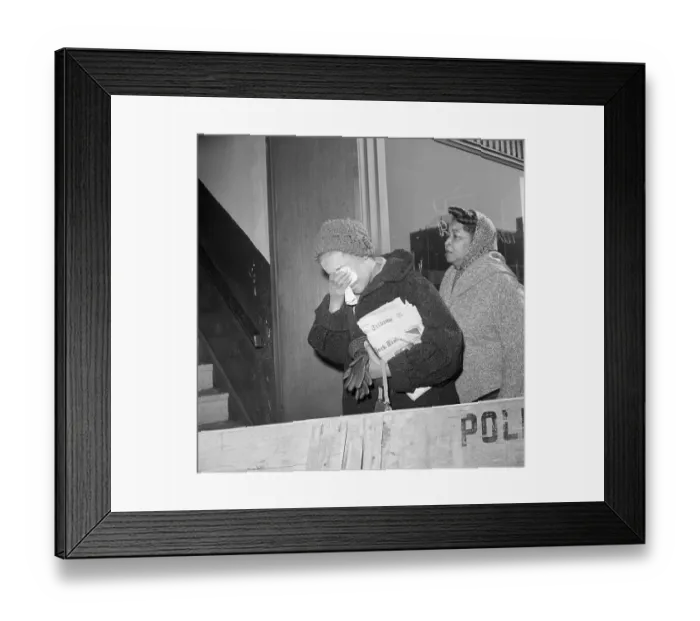 Framed Print : Woman Covering Face Leaving Funeral Home Framed Print : Woman Covering Face Leaving Funeral Home