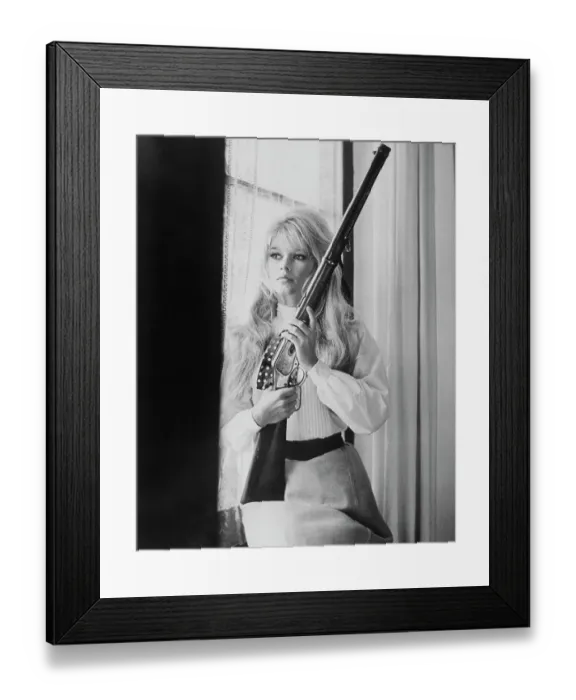 Framed Print : Brigitte Bardot Holding Gun Framed Print : Brigitte Bardot Holding Gun