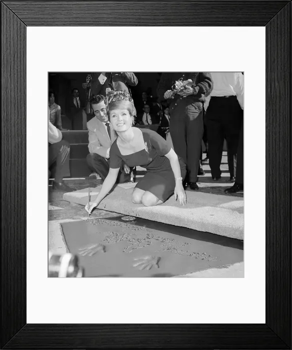 Framed Print : Debbie Reynolds Signing Her Name on Hollywood Pavement Framed Print : Debbie Reynolds Signing Her Name on Hollywood Pavement