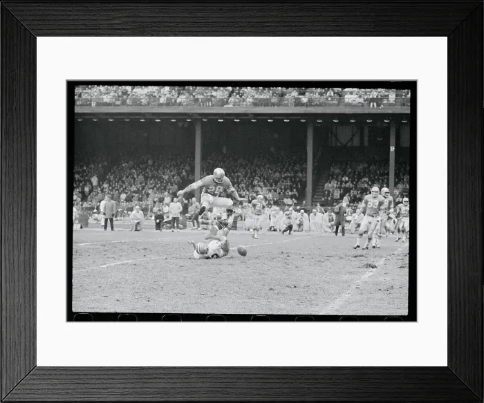 Framed Print : Yale Lary Jumping Over an Opponent Framed Print : Yale Lary Jumping Over an Opponent