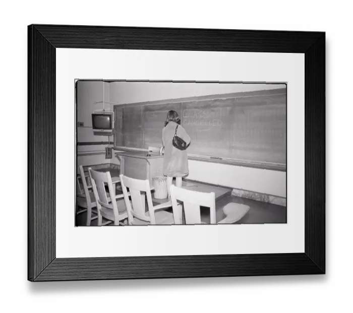 Framed Print : Woman Stands in Empty Classroom with Note Framed Print : Woman Stands in Empty Classroom with Note