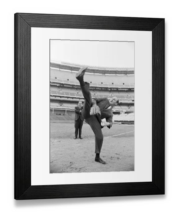Framed Print : Warren Spahn Does High Leg-Kick In Suit Framed Print : Warren Spahn Does High Leg-Kick In Suit