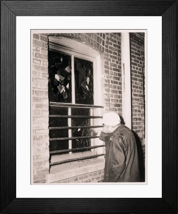 Framed Print : Firefighter Examining Bars over Window Framed Print : Firefighter Examining Bars over Window