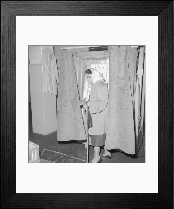 Framed Print : Elderly African American Woman Exiting Voting Booth Framed Print : Elderly African American Woman Exiting Voting Booth