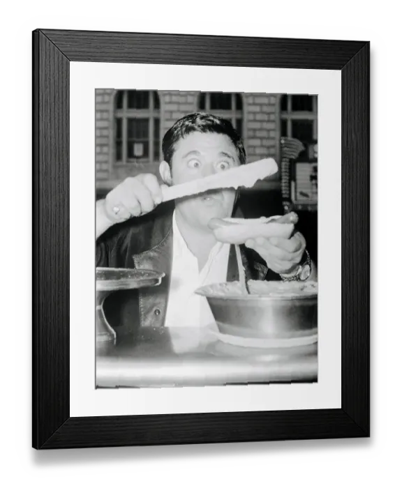 Framed Print : Comedian Buddy Hackett Preparing a Hot Dog
