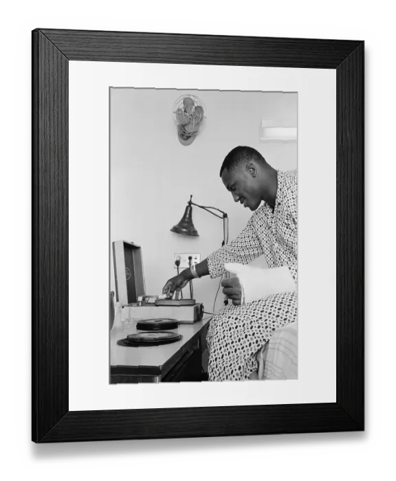 Framed Print : Joe Frazier Thumb In Cast Playing Records Framed Print : Joe Frazier Thumb In Cast Playing Records