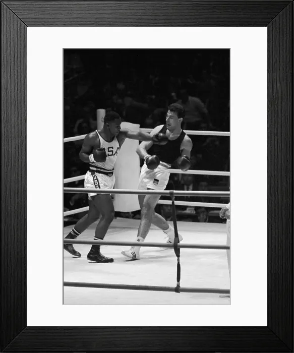 Framed Print : Joe Frazier Throws Punch at Hans Huber Framed Print : Joe Frazier Throws Punch at Hans Huber