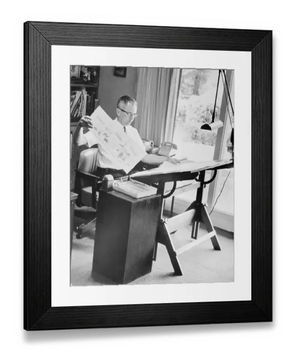 Framed Print : Charles Schulz Working on Drawing Board Framed Print : Charles Schulz Working on Drawing Board