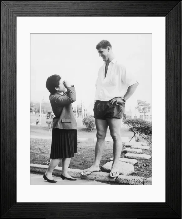Framed Print : Small Girl Photographing Tall Man Framed Print : Small Girl Photographing Tall Man