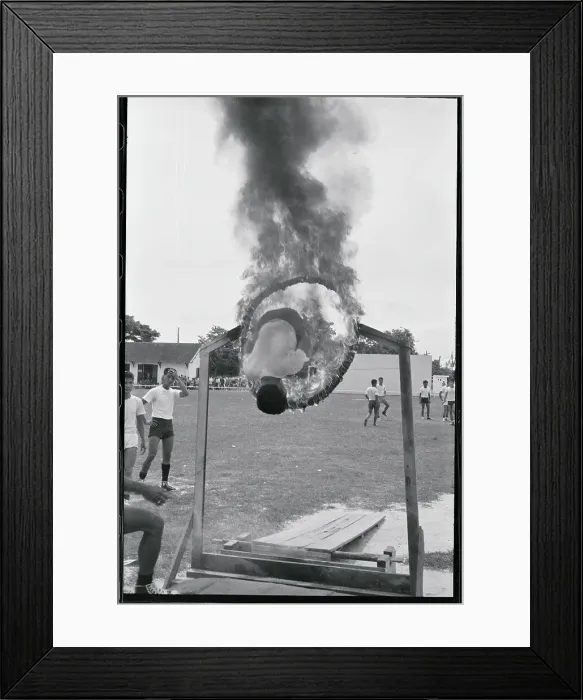Framed Print : Man Jumping Through Fiery Hoop Framed Print : Man Jumping Through Fiery Hoop